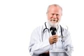 Smiling Senior Medical Doctor on White Background | TeleMed Inc.