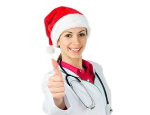 Women Doctor with Santa Hat and Holding a Thumbs Up | Medical Answering Service | Telemed Inc.