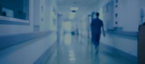 Nurse walking down hospital hallway | MyService | TeleMed Inc.
